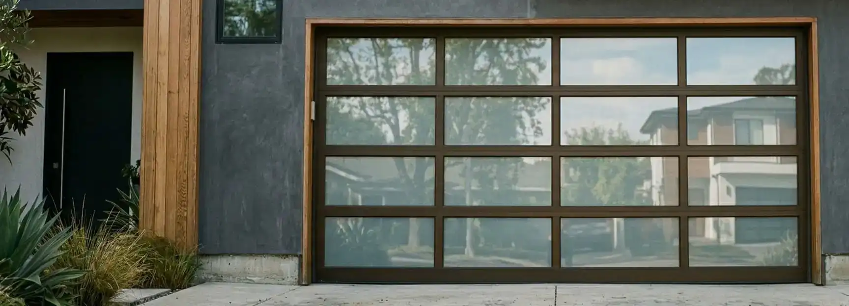 Aluminum frame full-view garage door on a modern property
